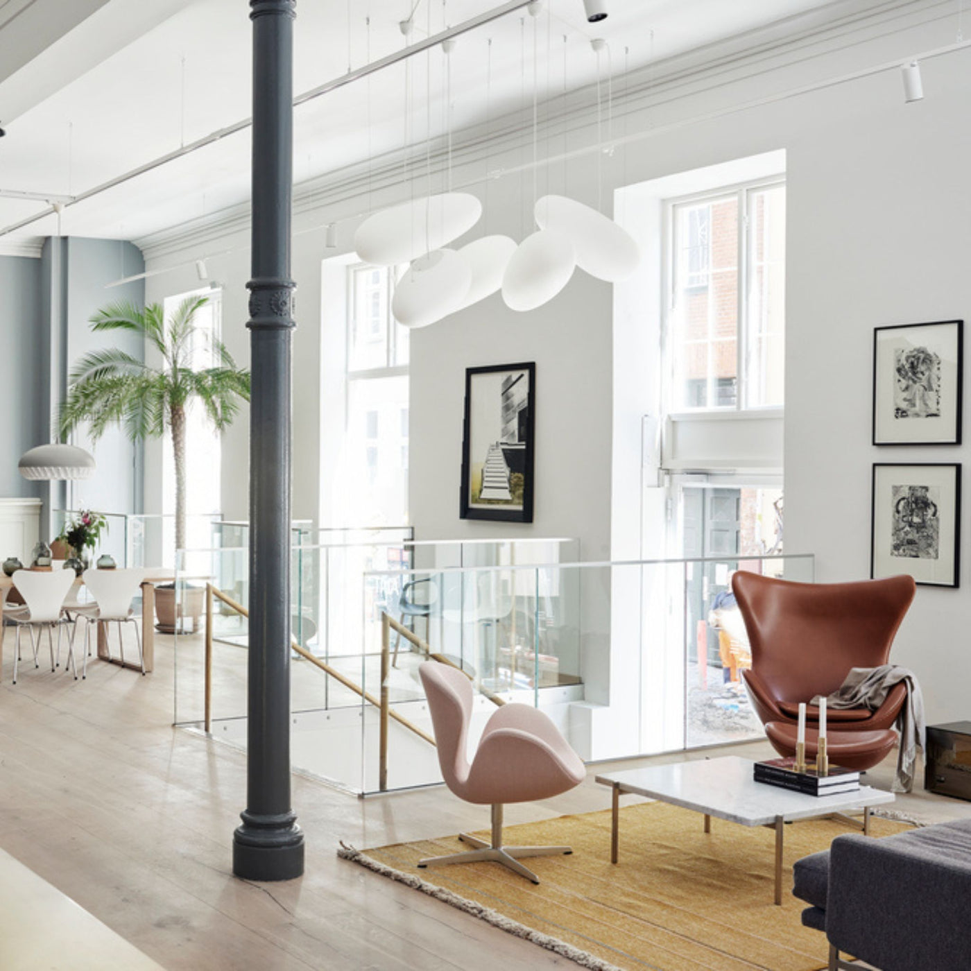 Fritz Hansen Swan and Egg Chairs with Series 7s in Background Copenhagen Showroom