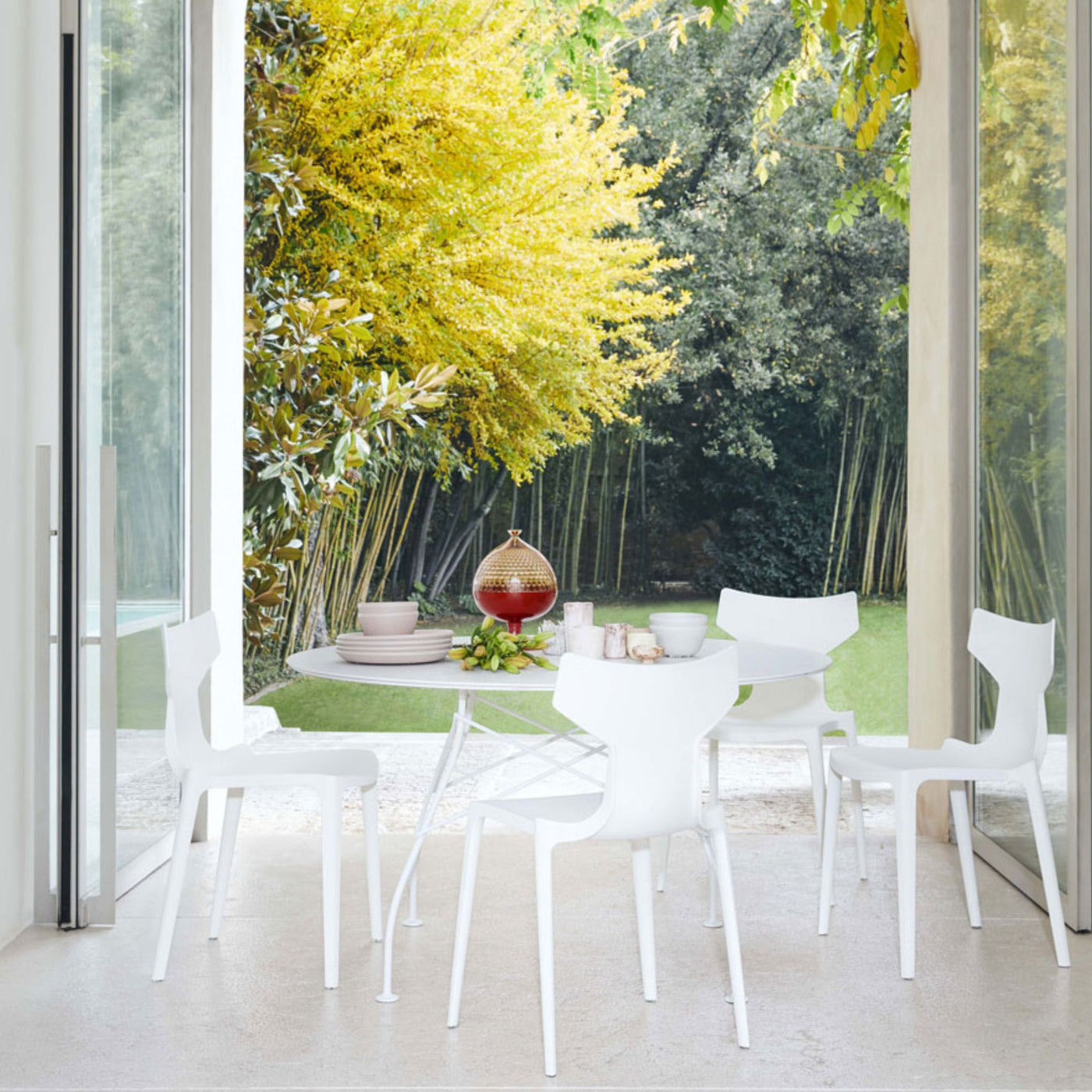 Kartell RE Chairs and Glossy Table by Antonio Citterio All White on Terrace of Italian Palazzo