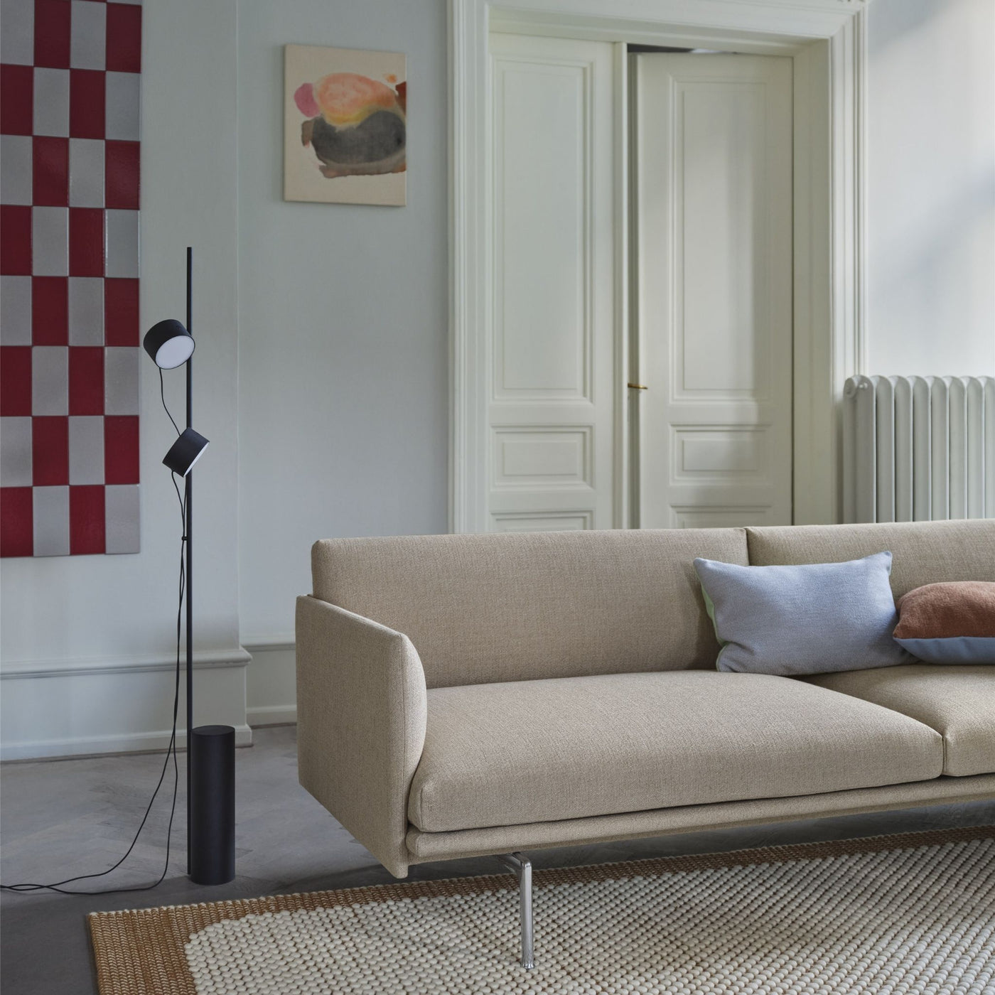 Muuto Outline Sofa in Copenhagen Apartment with Post Floor Lamp and Pebble Rug