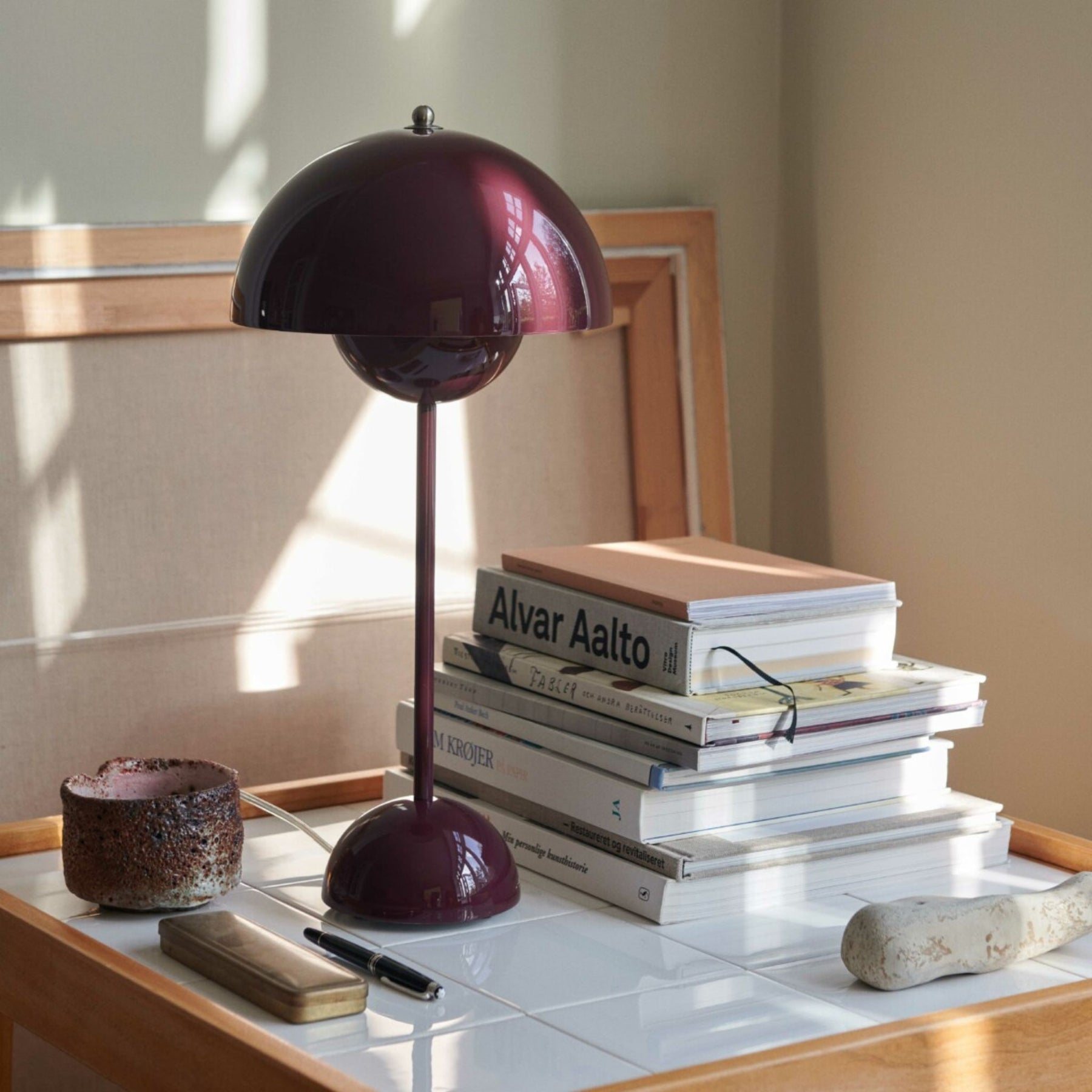 &Tradition VP3 Table Lamp Dark Plum on Table with Books