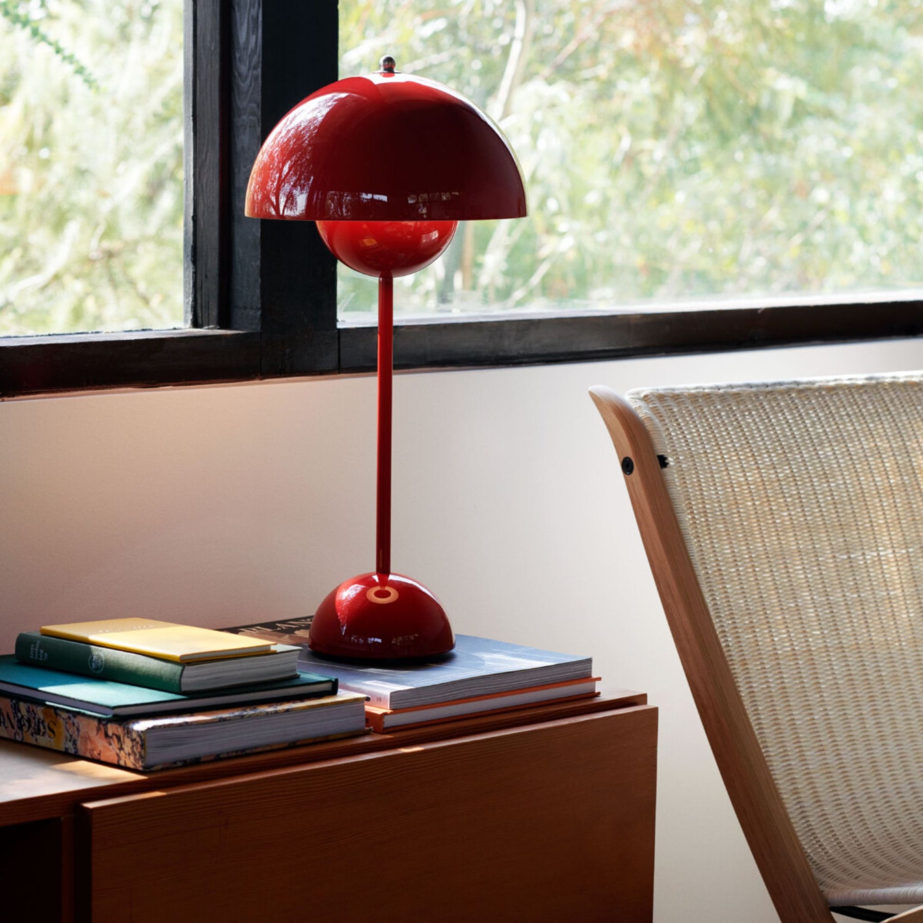 &Tradition VP3 Table Lamp Vermillion Red on Side Table with Books
