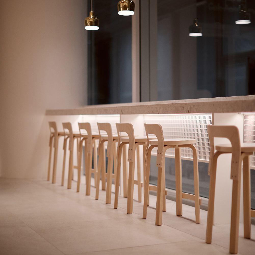 Artek Alvar Aalto K65 High Chairs Natural Birch at Window Counter at Night