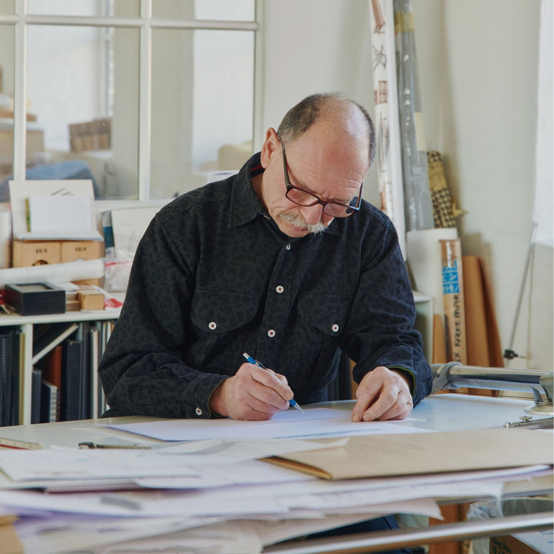 Boris Berlin Sketching in his Studio