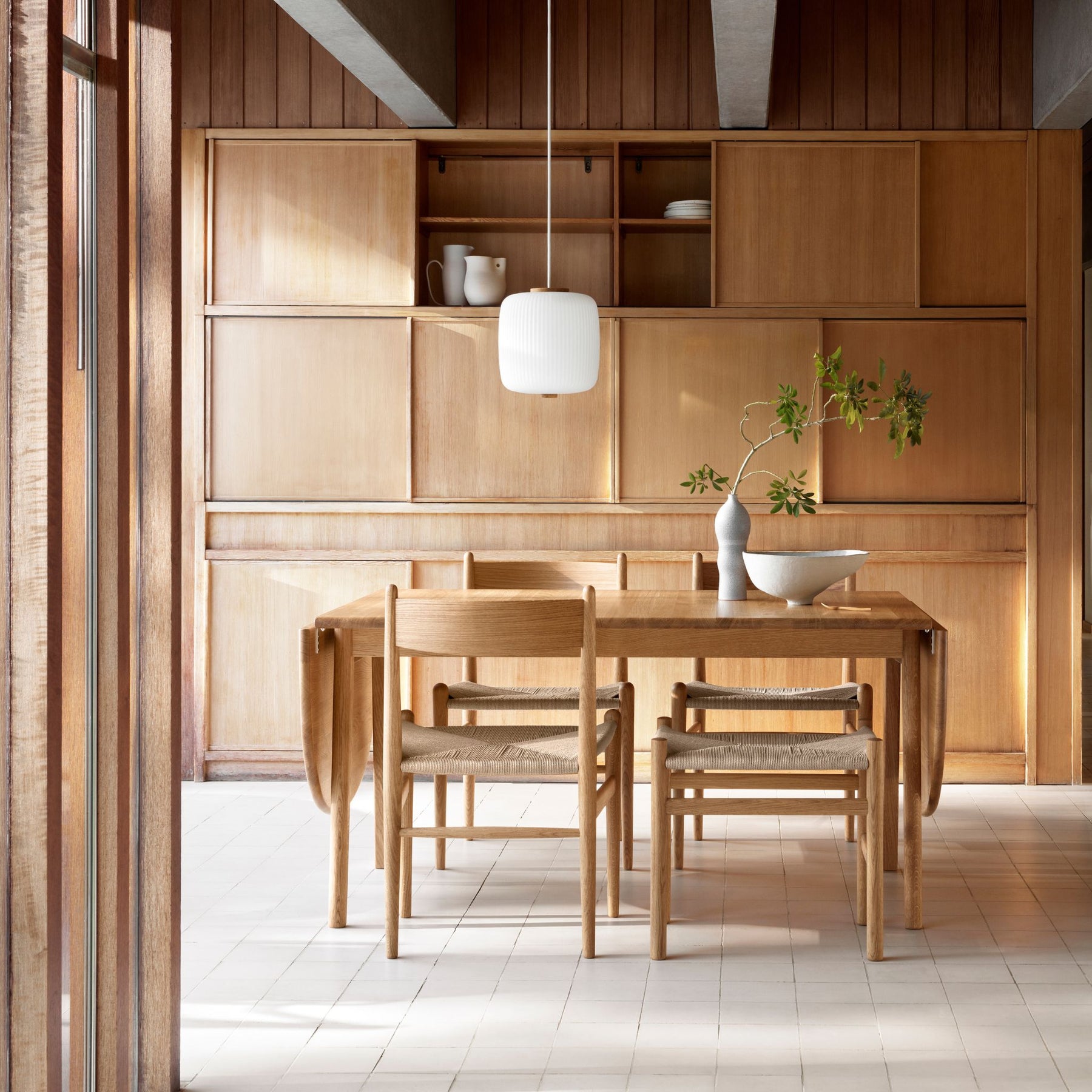 Wegner CH36 dining chairs in dining room with Drop Leaf Table and CH53 Stool