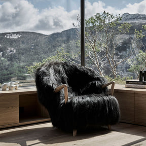 Eikund Fluffy Lounge Chair Black Sheepskin in Norwegian Summer House by Windows with view of Mountains