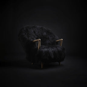 Eikund Fluffy Lounge Chair Black Sheepskin Oak Frame in Black Room
