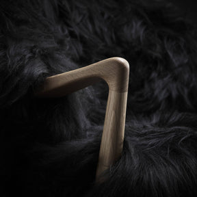 Eikund Fluffy Lounge Chair Black Sheepskin Oak Arm Detail