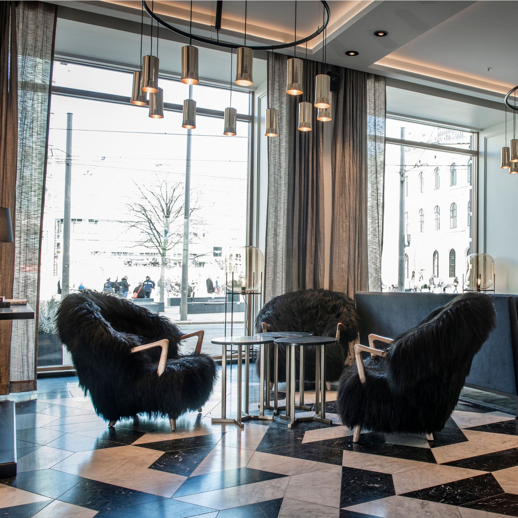 Eikund Fluffy Lounge Chairs Black Sheepskin Oak Arms in Norwegian Hotel Lobby