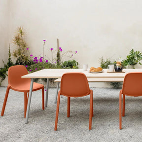 Emeco Broom Stacking Chairs Terracotta Orange Outdoors with Breakfast