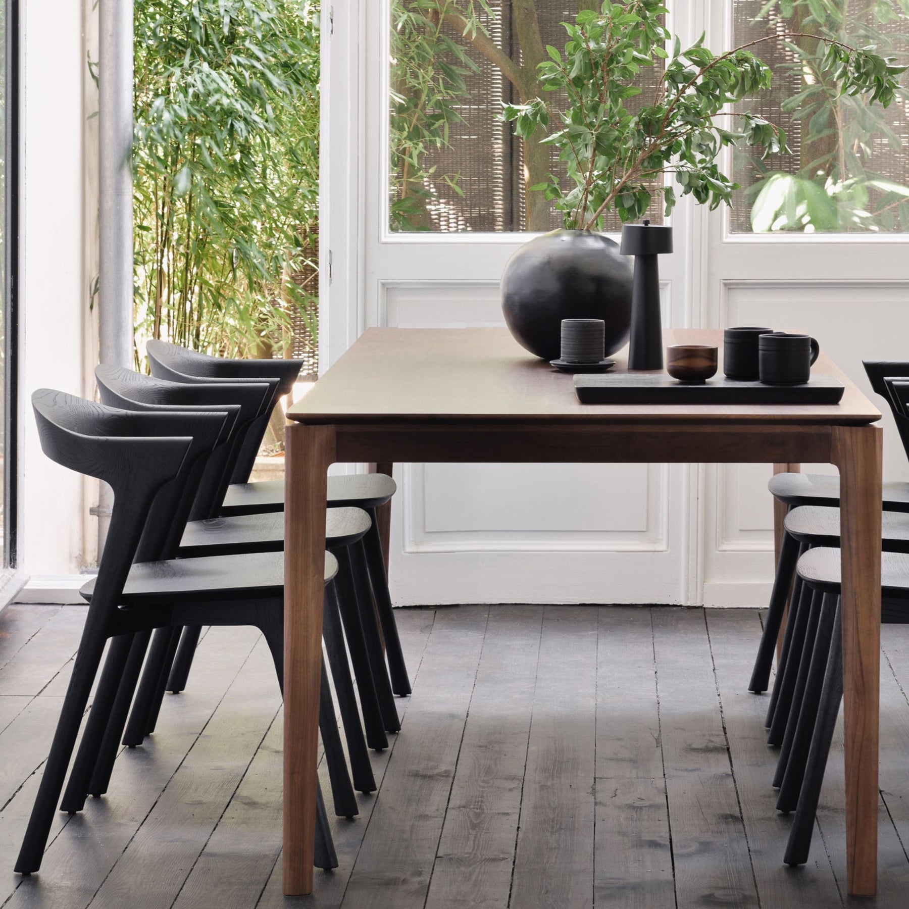 Ethnicraft Brown Varnished Teak Bok Dining Table and Black Oak Bok Chairs in Dining Room