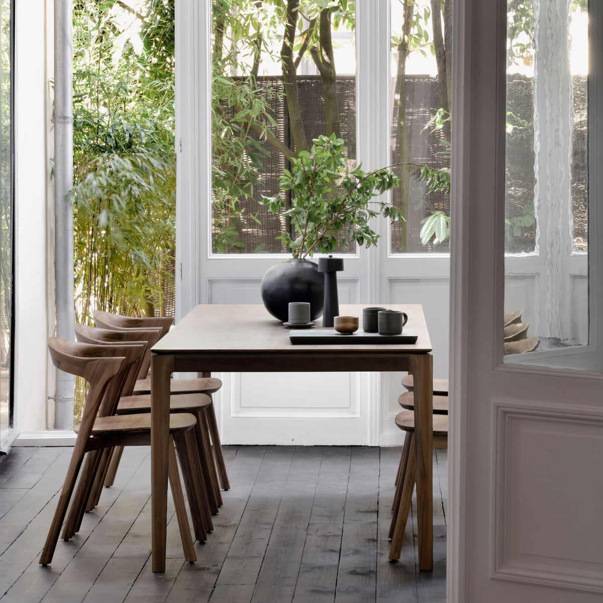 Ethnicraft Brown Varnished Teak Bok Dining Table and Chairs in Situ