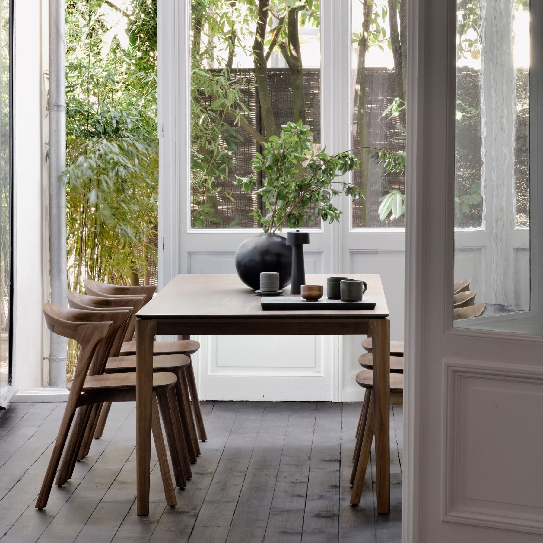 Ethnicraft Brown Varnished Teak Bok Dining Table and Chairs in Situ