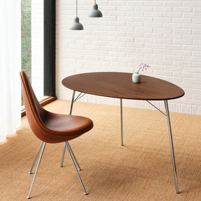 Fritz Hansen Egg Table  by Arne Jacobsen in Home Office with leather Egg Chair and Bud Vase