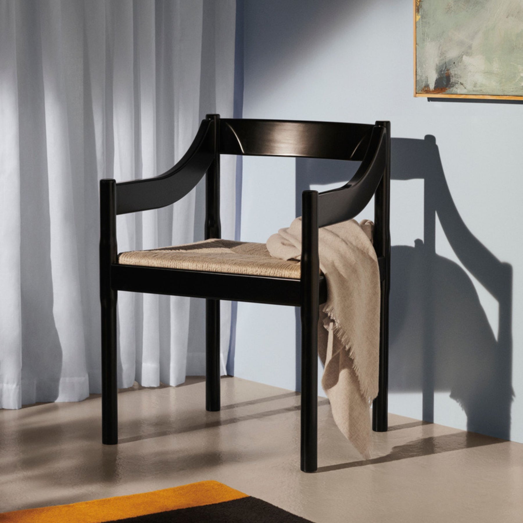 Fritz Hansen Carimate Chair by Vico Magistretti Black Ash in Room with Blanket