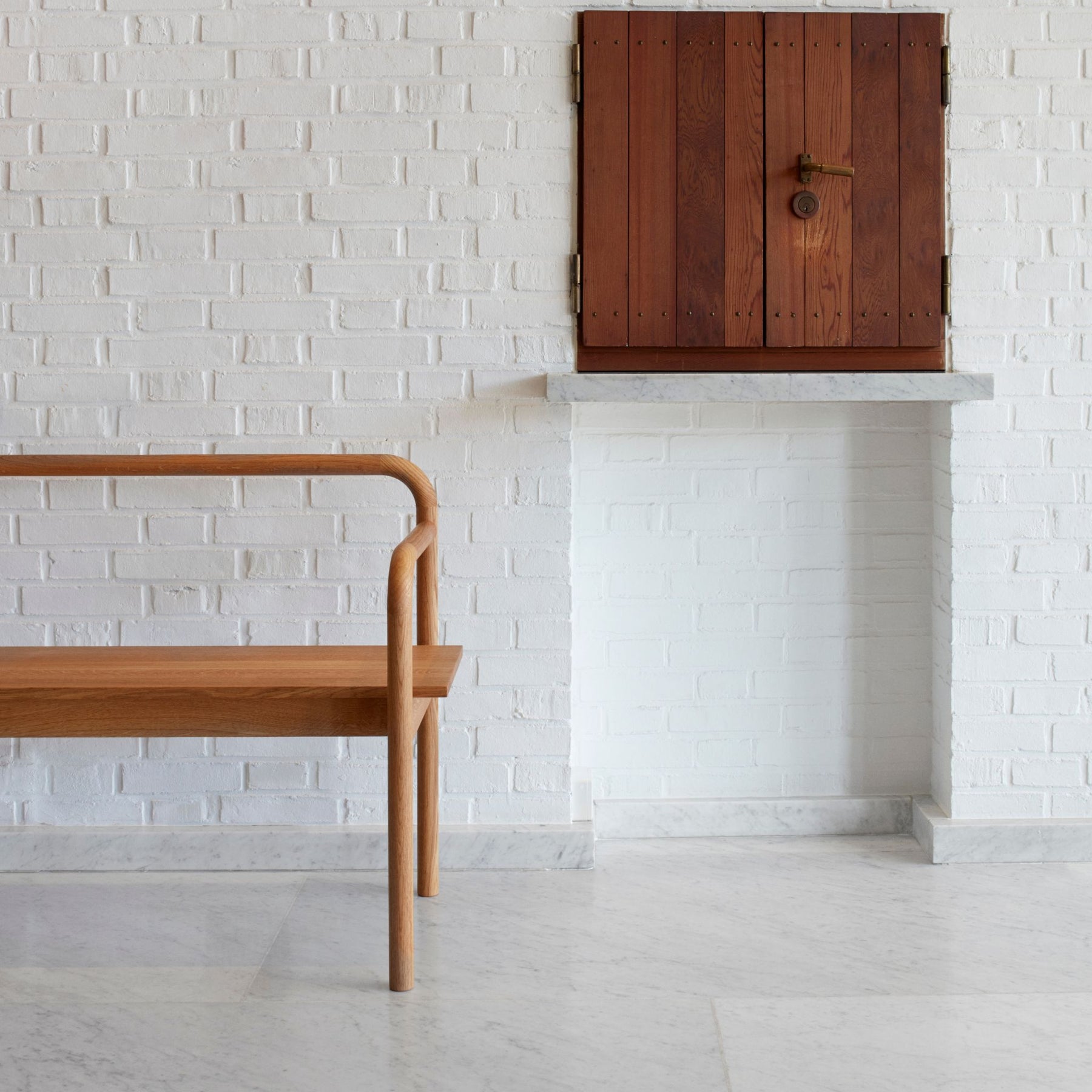 Fritz Hansen Skagerak Maissi Bench Oiled Oak by White Brick Wall