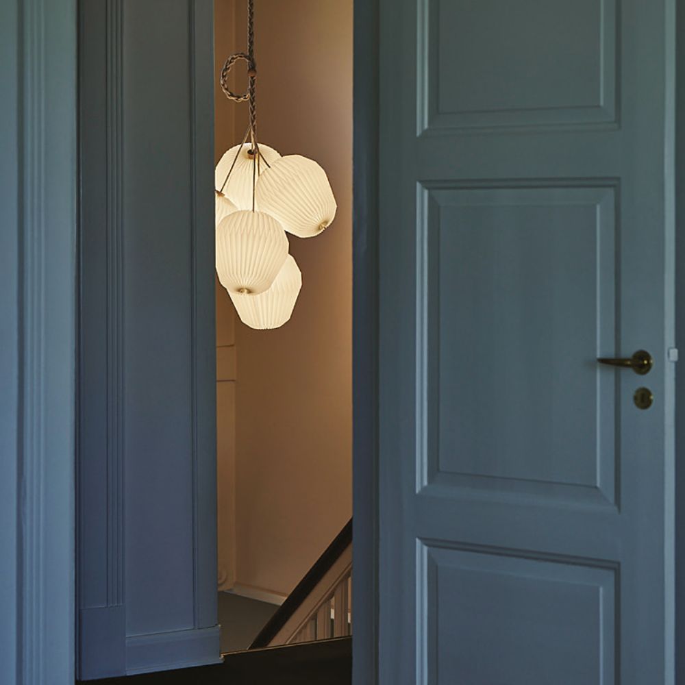 Le Klint Bouquet Chandelier 5 Shades Illuminated in Stairwell