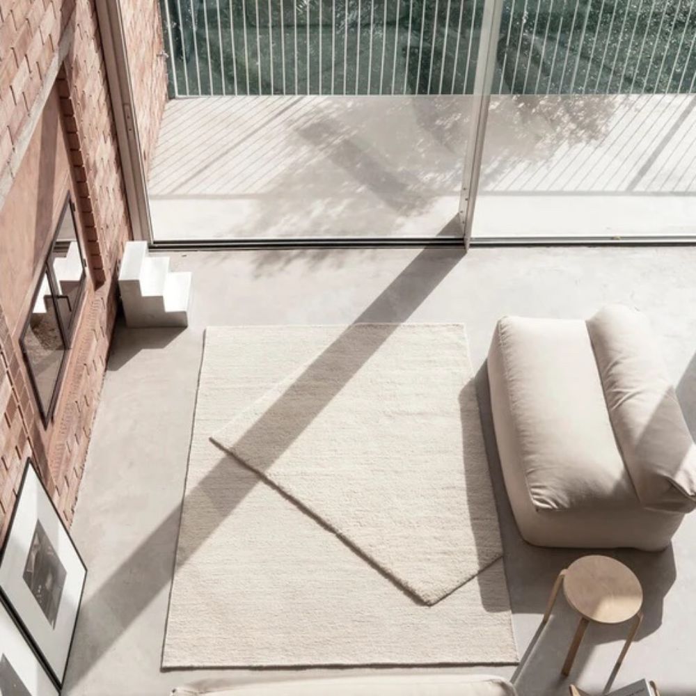 nanimarquina oblique rug ivory by matthew hilton in light-filled Barcelona loft