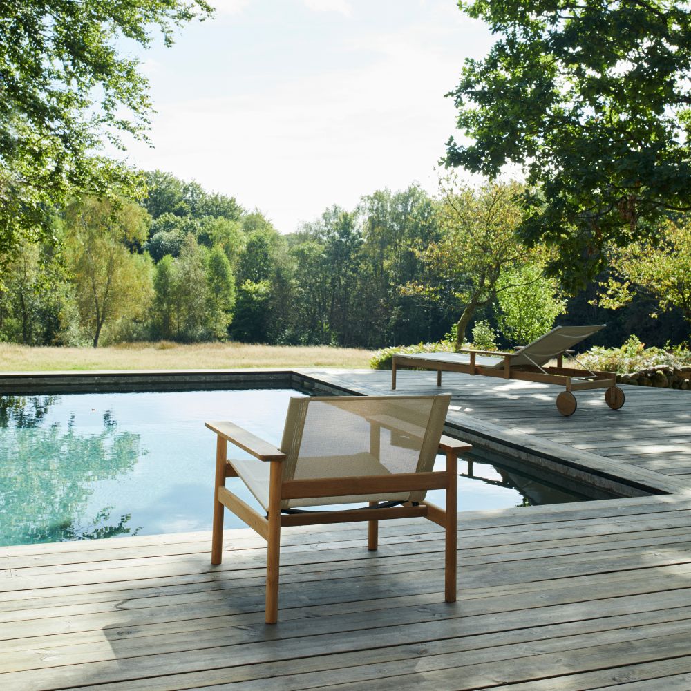 Pelagus Teak Lounge Chair and Chaise by Pool