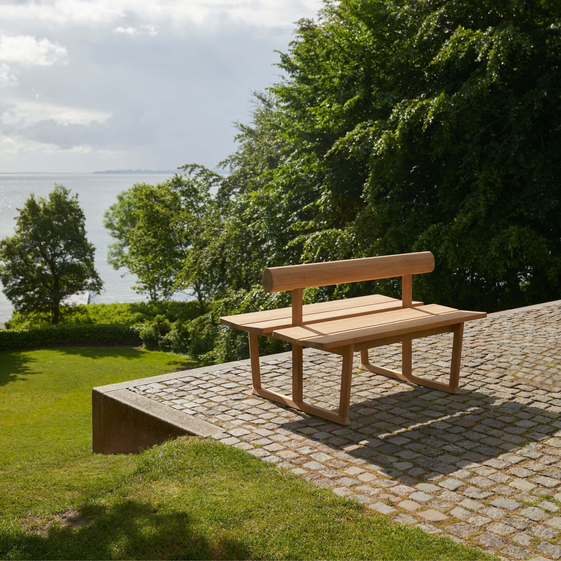 Fritz Hansen Skagerak Banco Bench Double on Cobblestone Patio