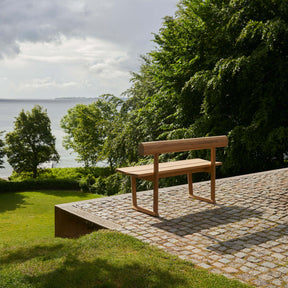 Fritz Hansen Skagerak Banco Bench on Cobblestone Terrace Overlooking Sea