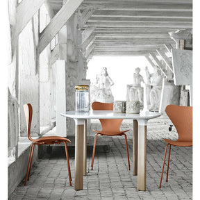 Analog Table in Room with Tal R Series 7 Chairs in Chevalier Orange Jaime Hayon Arne Jacobsen Fritz Hansen