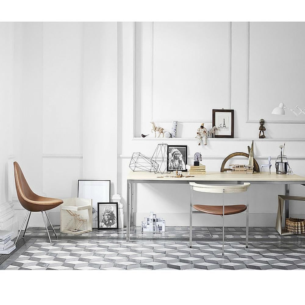 Brown Leather Drop Chair in room with Poul Kjaerholm Chair and Table Fritz Hansen