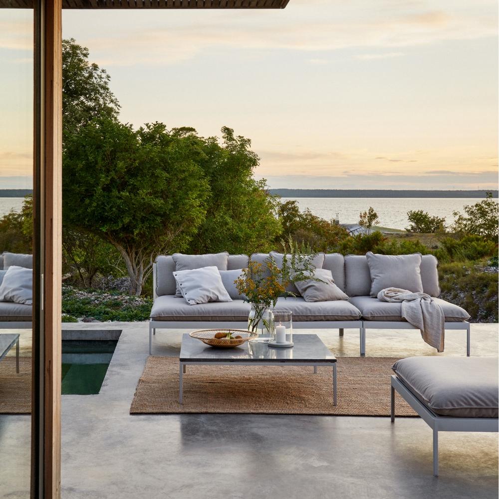 Skargaarden Bönan Lounge Sofa, Ottoman, and Large Table with Dark Grey Limestone Top poolside