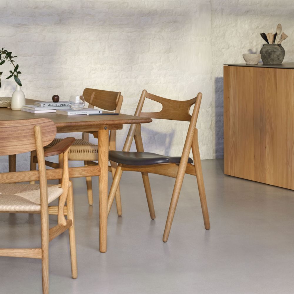 Carl Hansen Wegner CH327 Dining Table Corner Detail in Danish Summer House Kitchen with mixed Wegner Dining Chairs