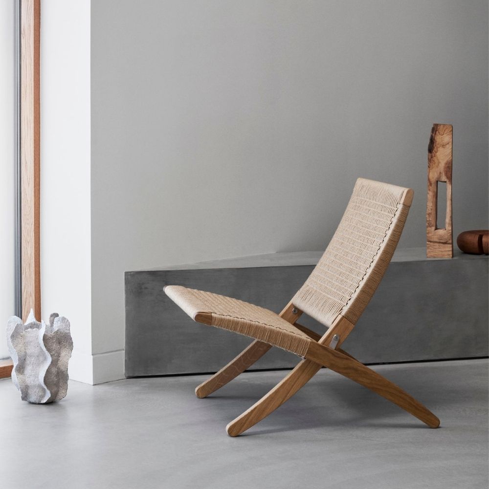 Carl Hansen Cuba Chair with Papercord in room with sculpture