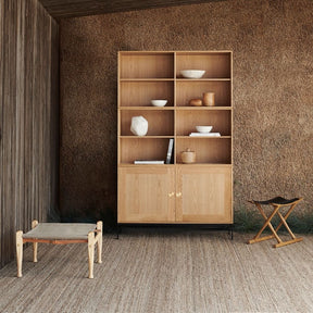 Carl Hansen Safari Footstool in room with Fabricius Kastholm Shelves and Ole Wanscher Egyptian Stool