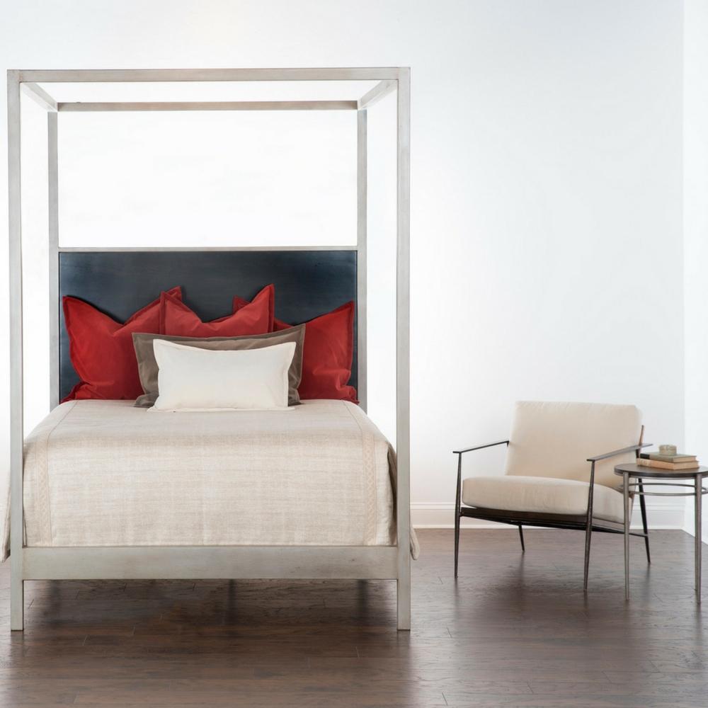 Charleston Forge Sloan Canopy Bed in room with Emmitt Lounge Chair
