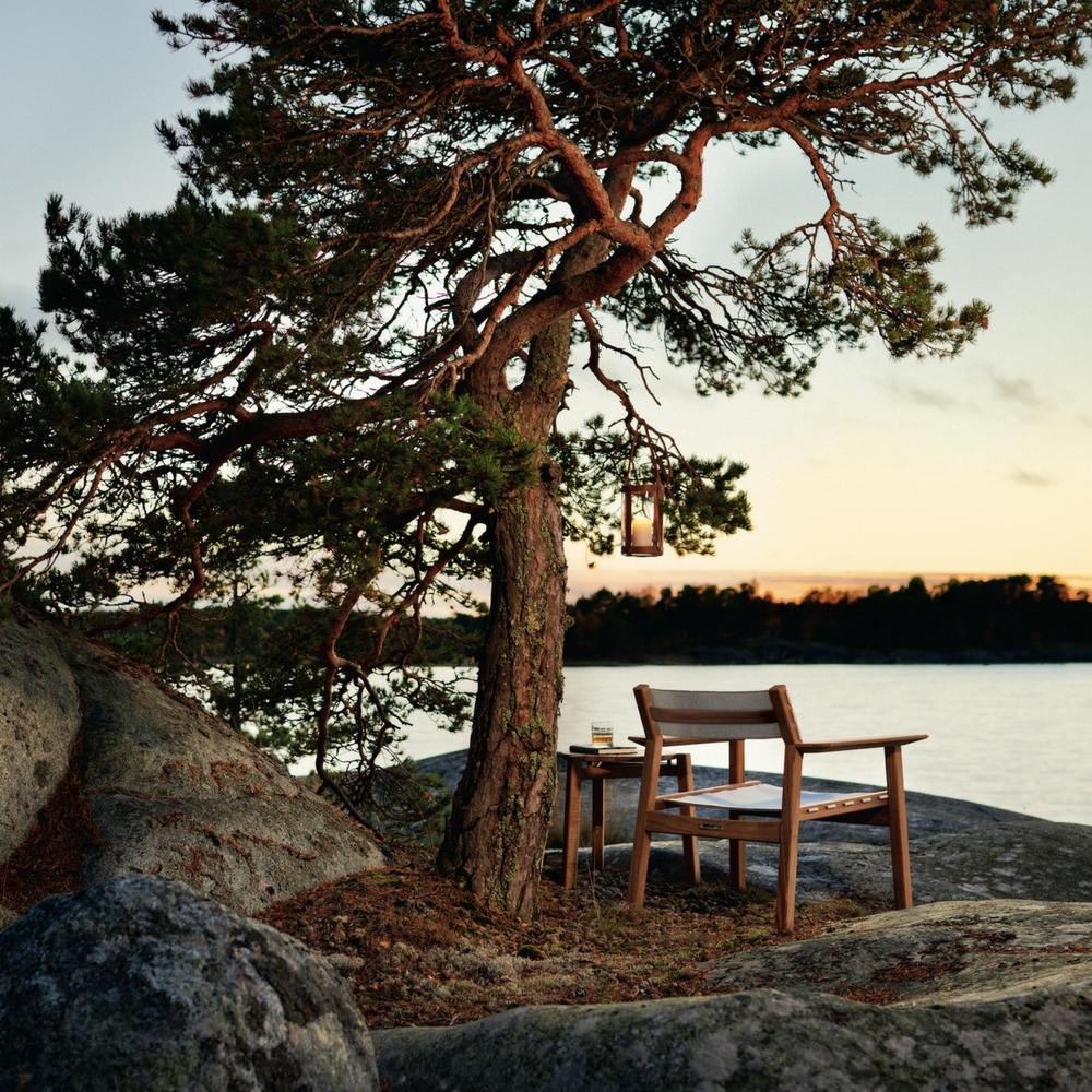 Djurö Lounge Chair with Batyline Seat and Backrest with Djurö Sidetable and Marstrand Candle Lantern by Skargaarden