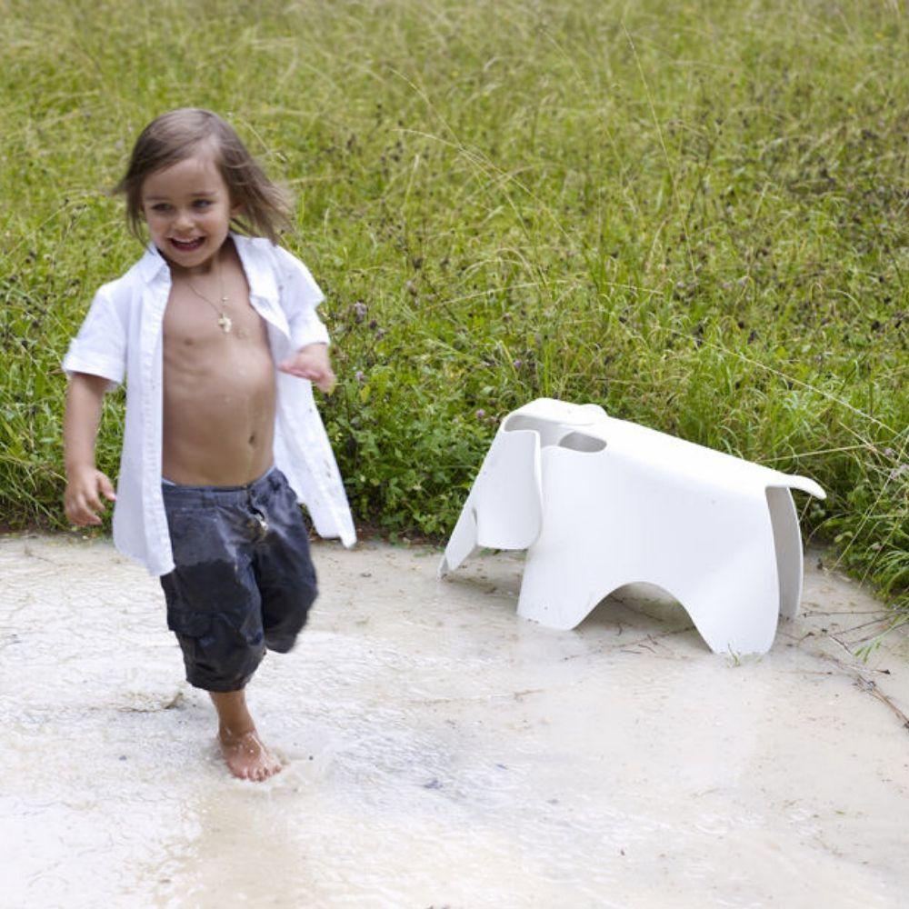 Vitra Eames Elephant Outdoors with kid in mud puddle