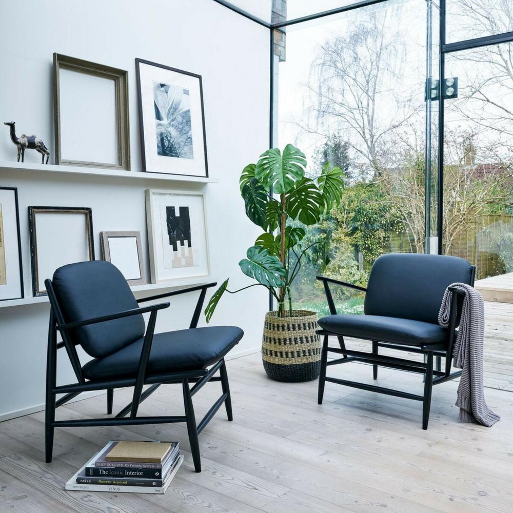 ercol Von armchairs in room