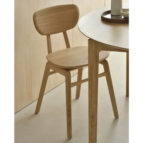 Ethnicraft Oak Pebble Dining Chair in Kitchen with Round Oak Bok Extendable Dining Table