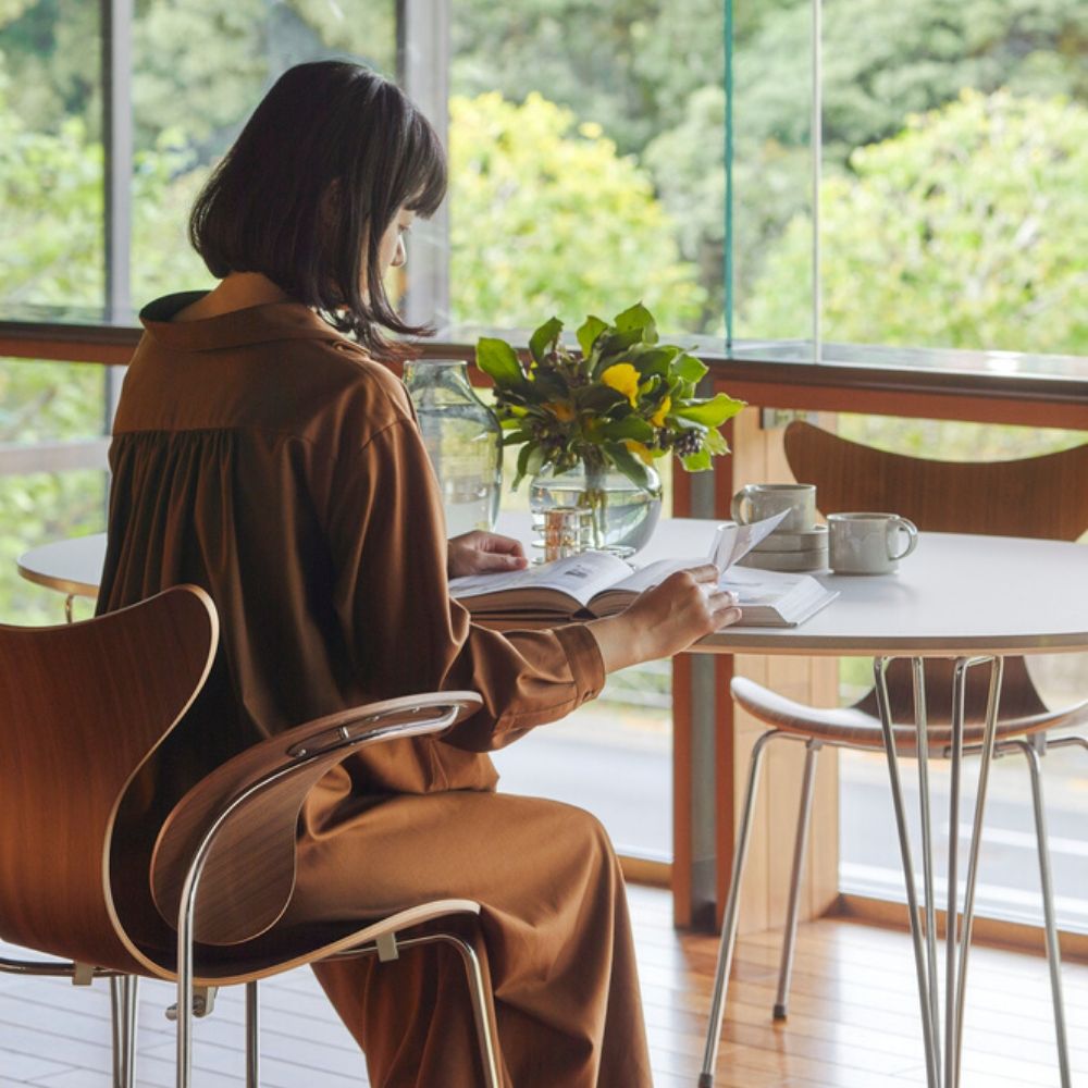 Fritz Hansen Lily Armchair Model 3208 in room with woman