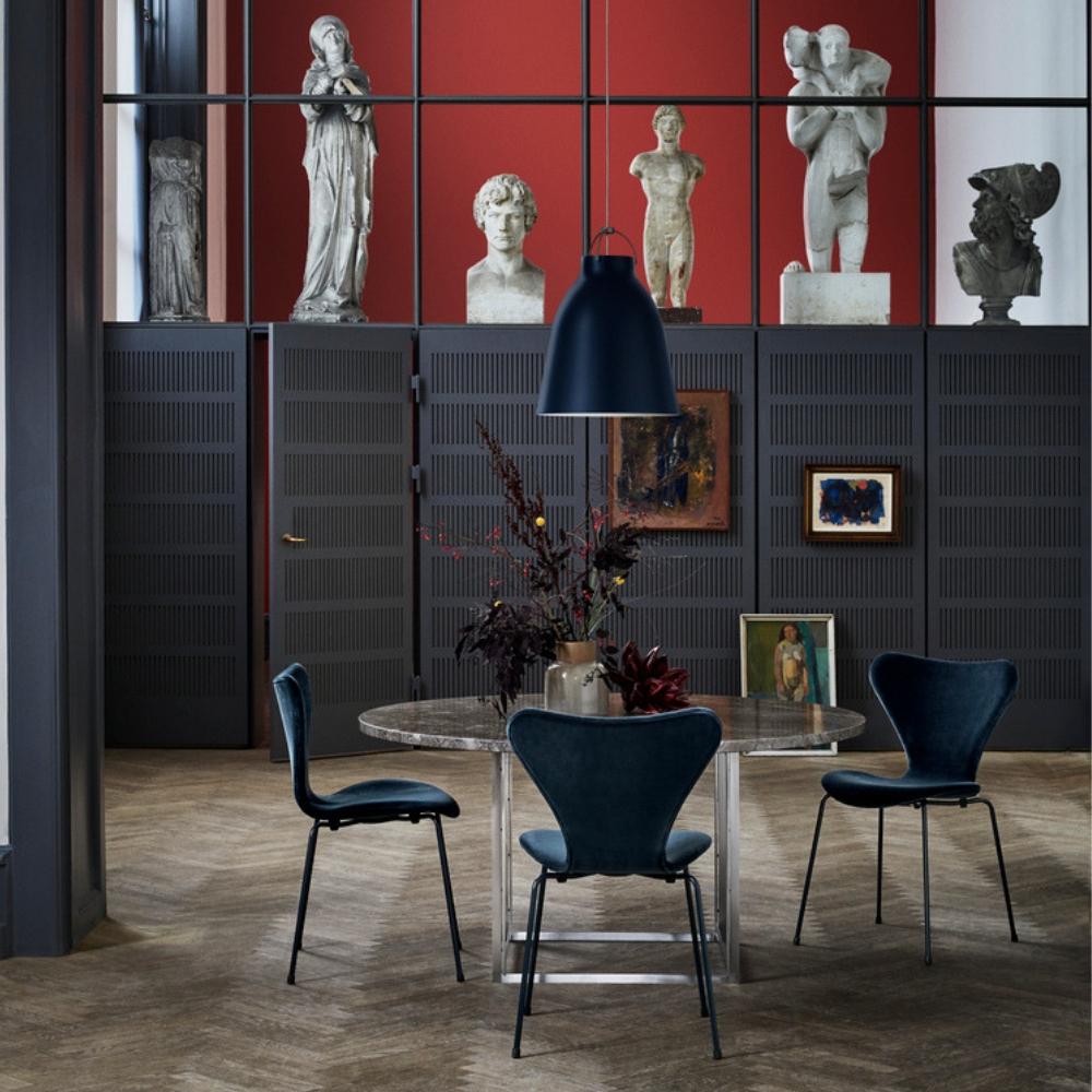 Fritz Hansen Ultramarine Caravaggio Pendant Light by Cecilie Manz with Poul Kjaerholm PK54 Table and Lala Berlin Series 7 Chairs in Caspian