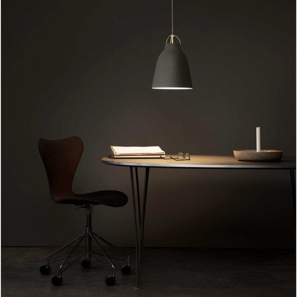 Fritz Hansen Cecilie Manz Caravaggio Pendant Light in home office with Super Elliptical Table and Series 7 Chair