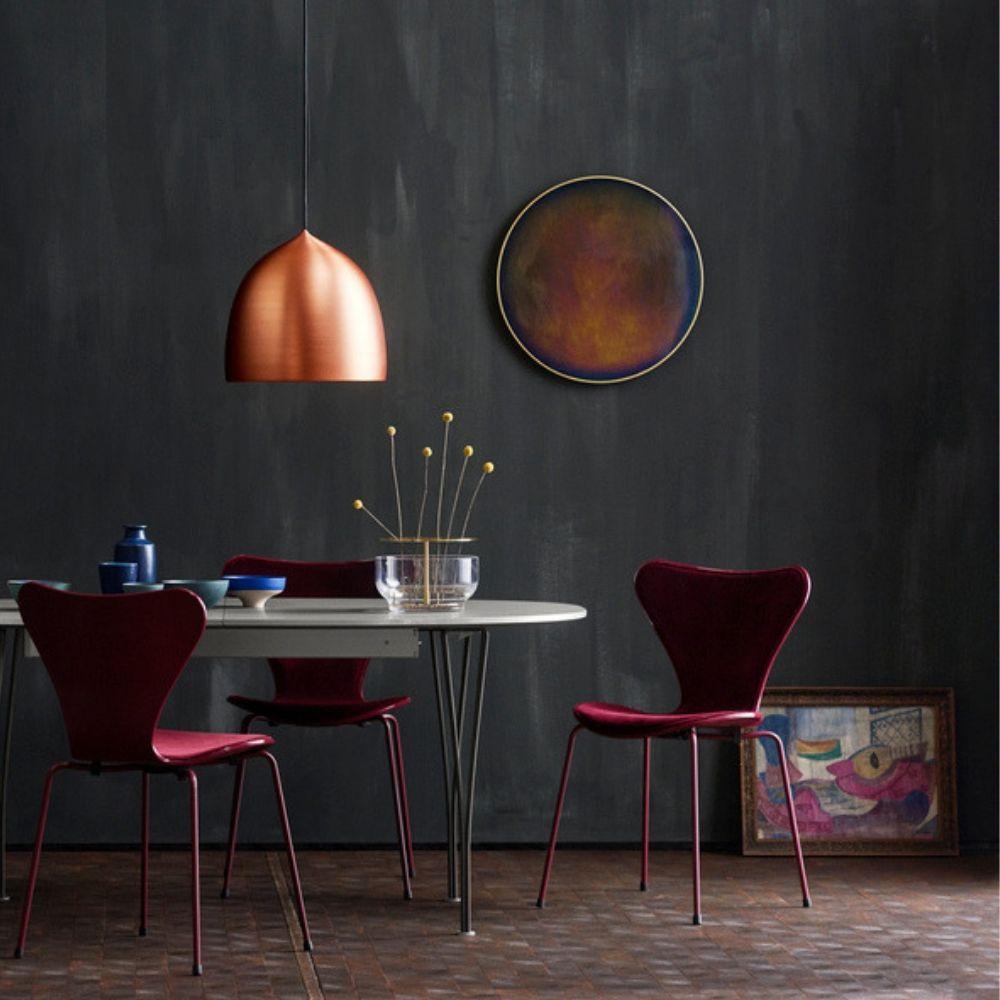 Fritz Hansen Gam Fratesi Copper Suspence Chairs in room with Burgandy La La Berlin Series 7 Chairs