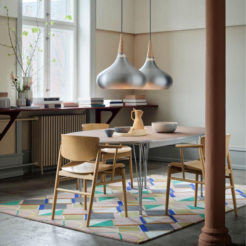 Fritz Hansen Orient Pendant Lights in dining room with Nendo N01 chairs and Super Elliptical Dining Table