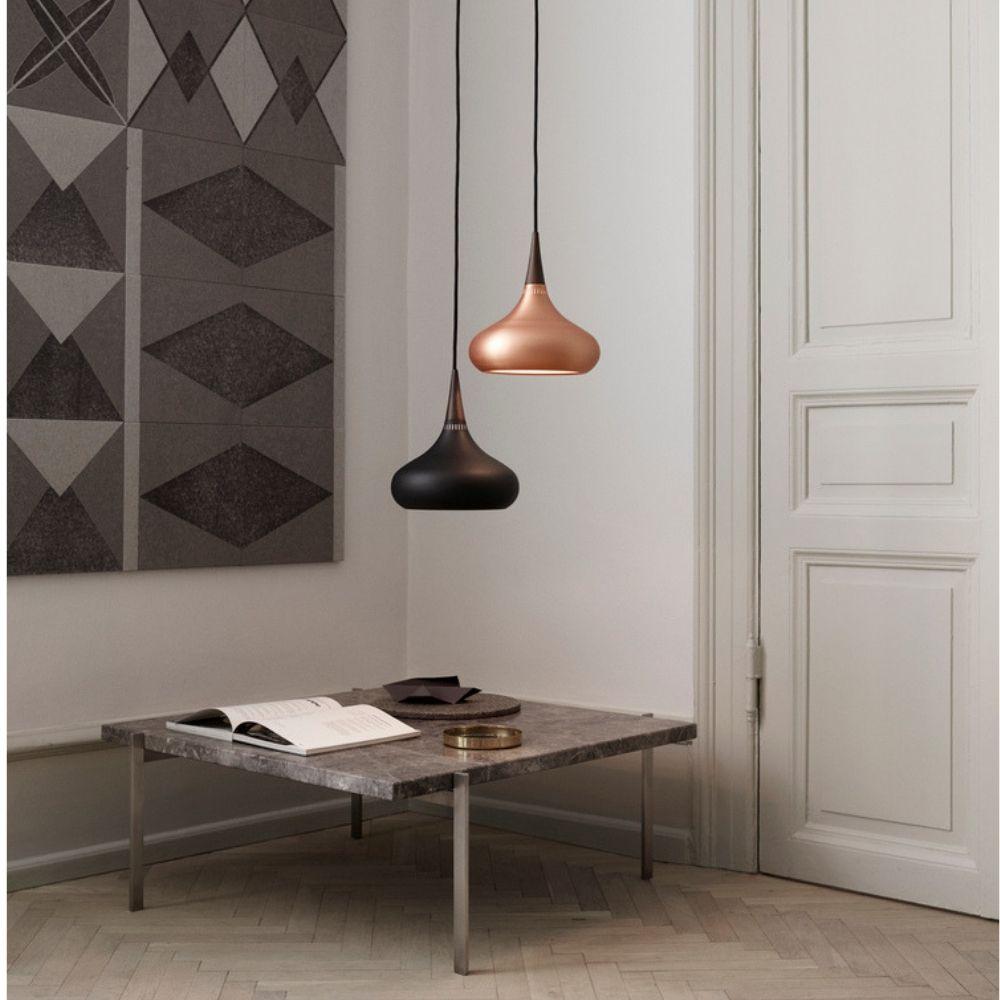 Fritz Hansen Orient Pendant Lights in room with Poul Kjaerholm Coffee Table