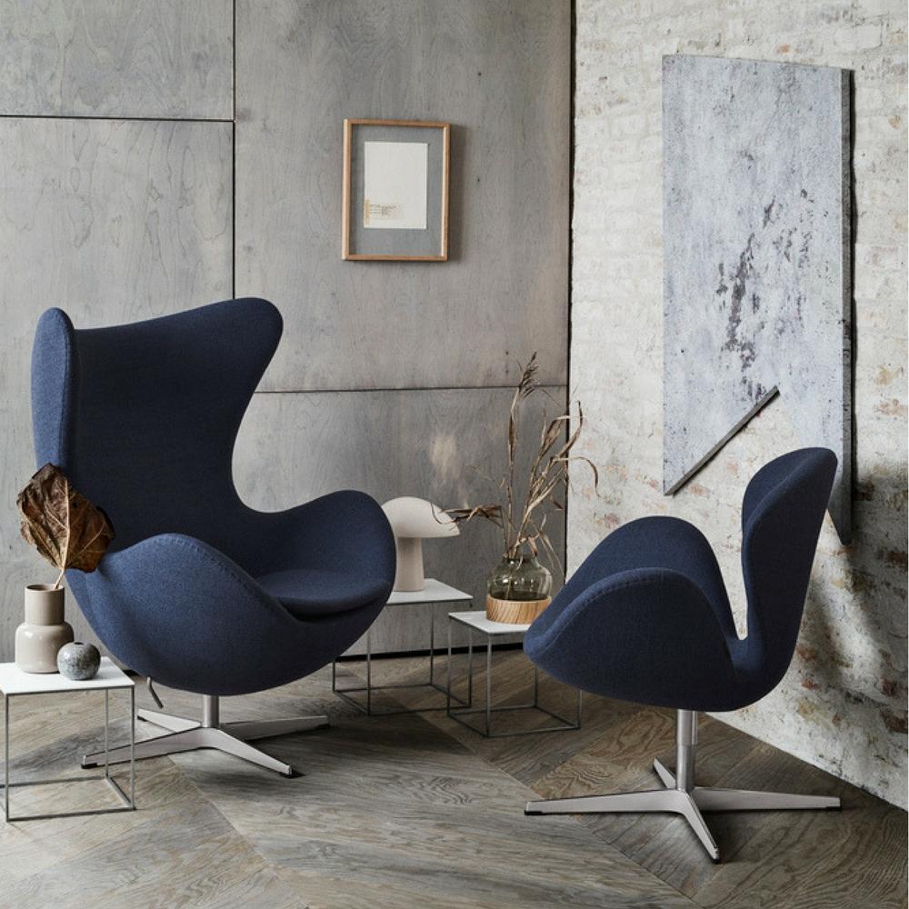 Fritz Hansen Egg and Swan Chairs Dark Blue in room with Art