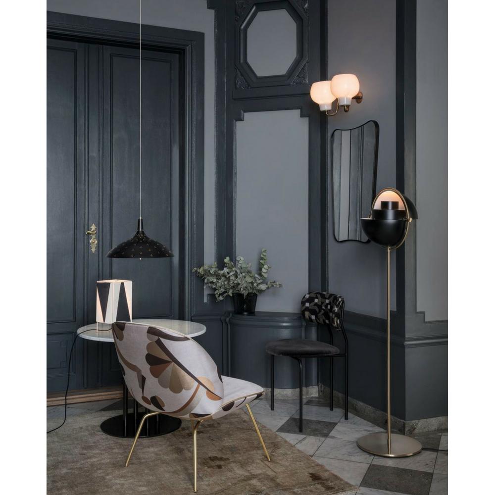 GUBI Muli Lite Floor Lamp Black and Brass in room with Beetle Lounge Chair and Coco Dining Chair