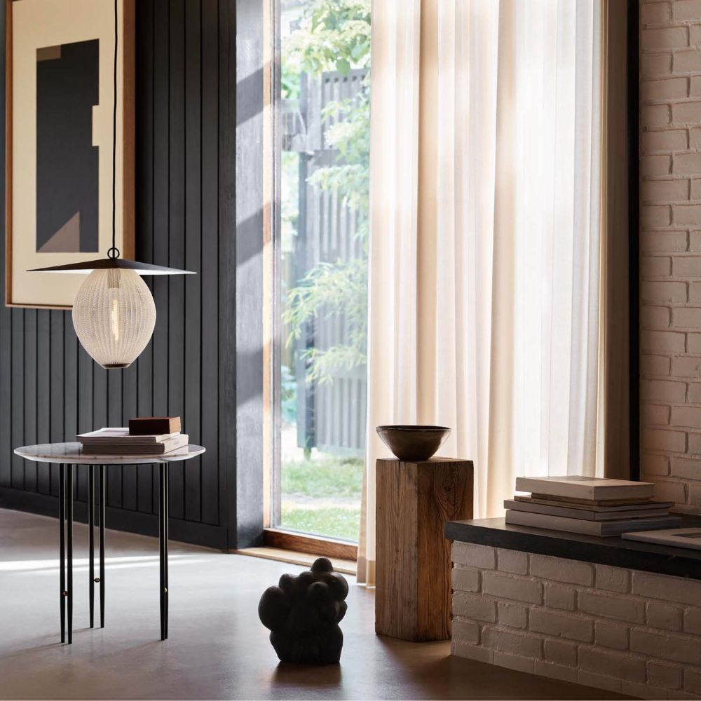 GUBI Satellite Pendant in Living Room with IO Table
