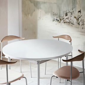 Hans Wegner CH388 Dining Table White with CH88 Chairs in Room with Mural Carl Hansen & Son