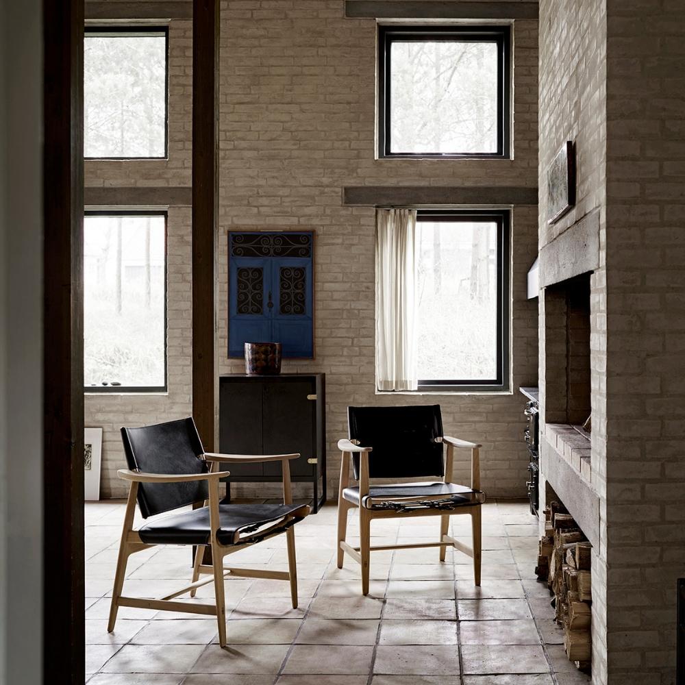 Borge Mogensen Huntsman Chairs black leather by fireplace Carl Hansen & Son