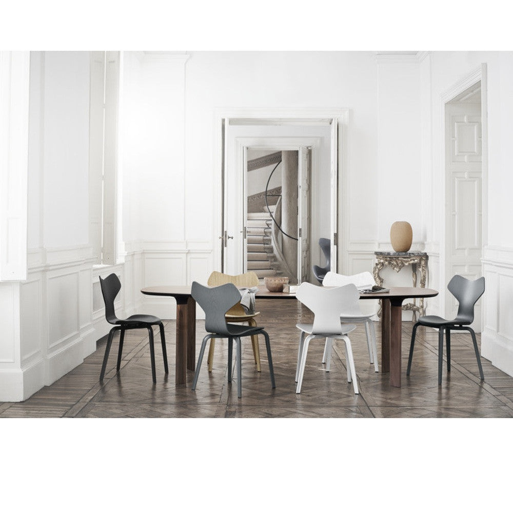 Jaime Hayon Analog Table Walnut with Arne Jacobsen Grand Prix Chairs in Room