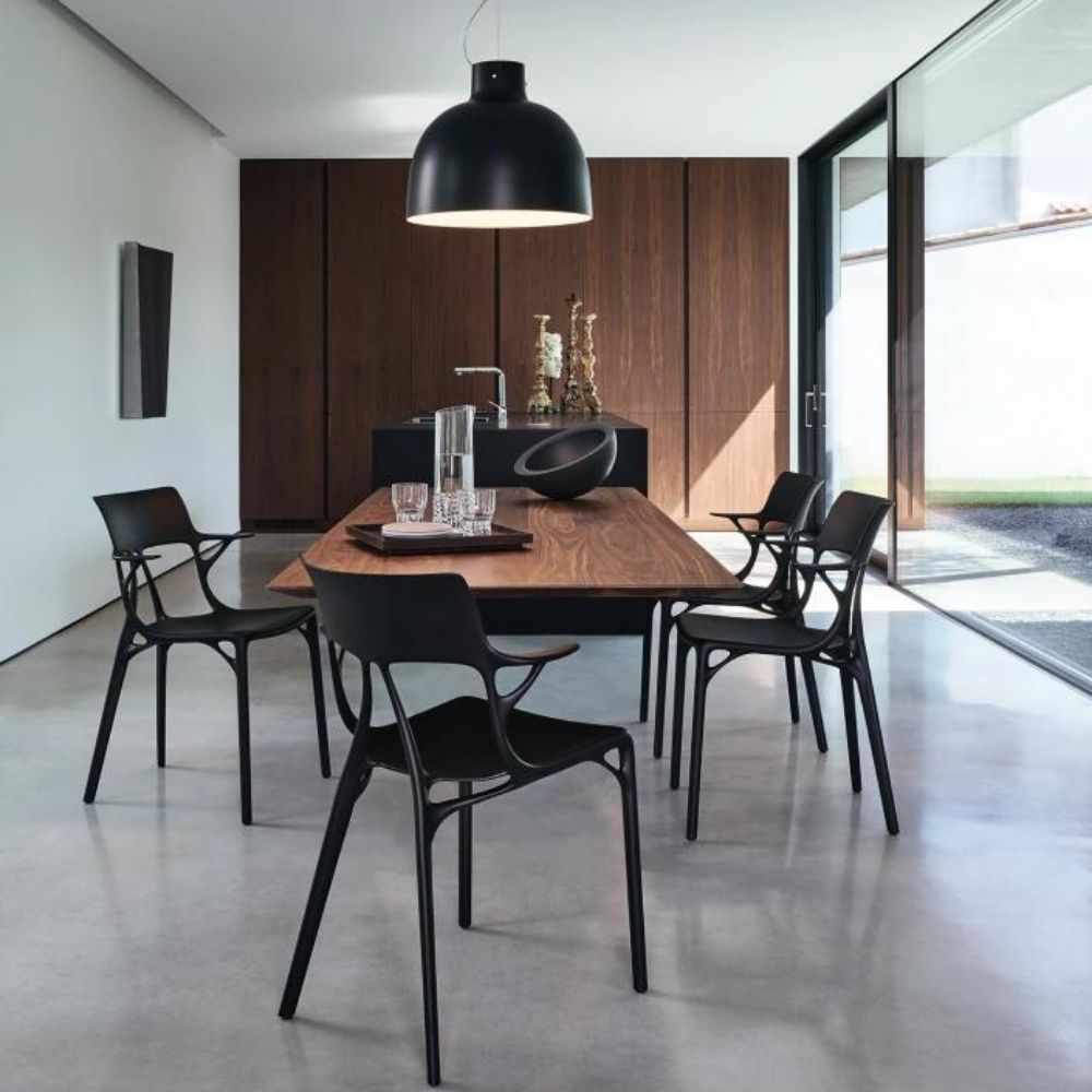 Kartell A.I. Chairs by Philippe Starck in Dining Room with floating Walnut Table