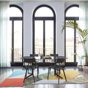 Kartell A.I. Chairs by Philippe Starck in dining room with Antonio Citterio Table