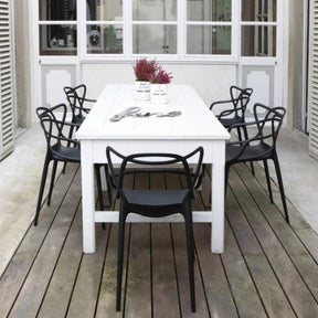Kartell Masters Chairs Black Outdoors with White Farm Table
